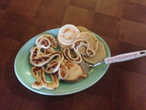 Large Jadite platter of pancakes shaped like snake