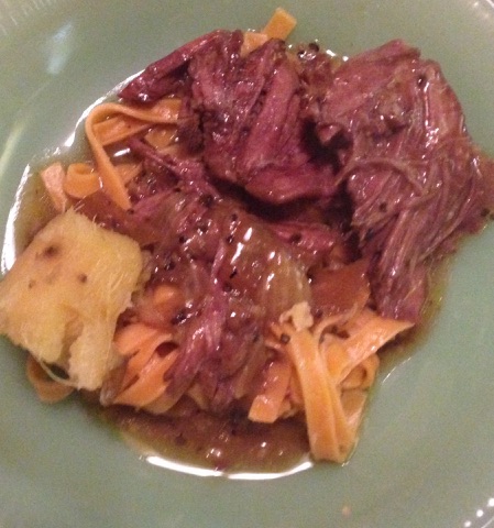 Braised Beef Roast Served on a Bed of Egg Noodles with  Smoky Gravy