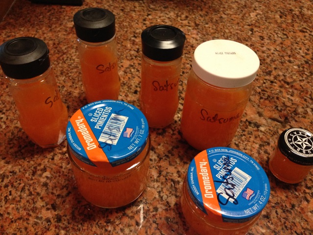 Glass Jars with Satsuma Juice ready to be placed in freezer