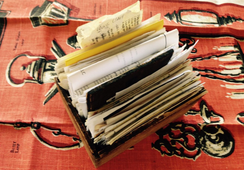 Treasure of recipes in antique box on vintage linen