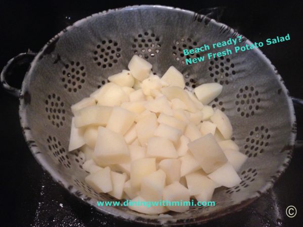 Draining Potatoes in vintage colander for Beach ready? New Fresh Potato Salad Recipe www.diningwithmimi.com