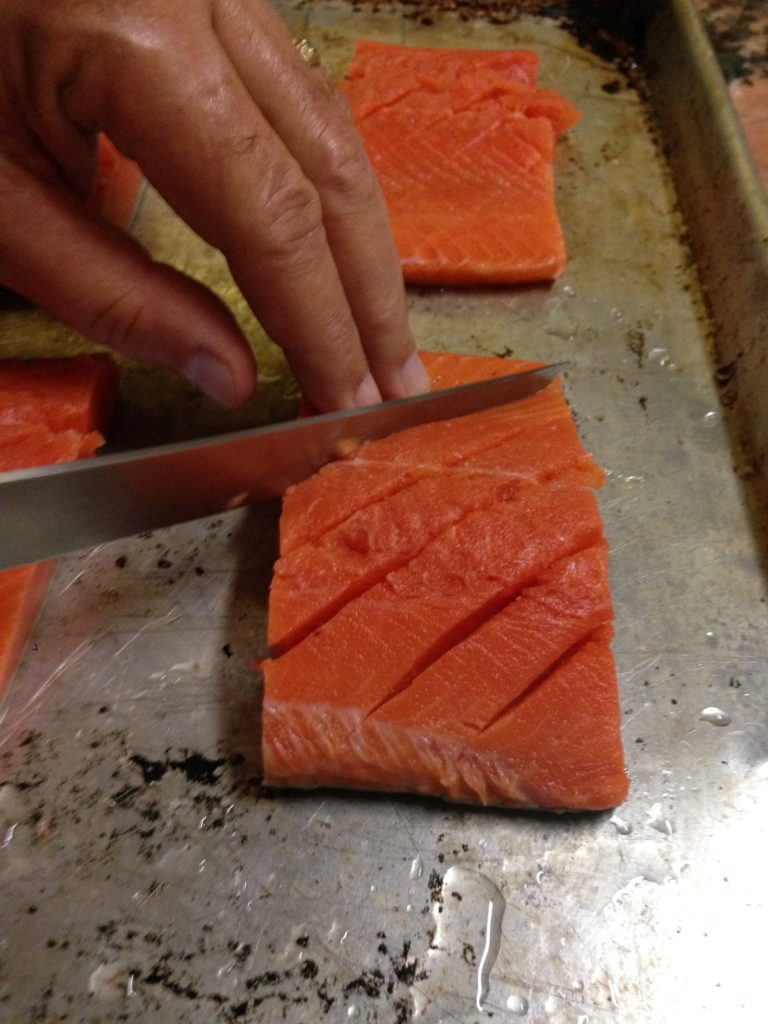 Fresh salmon on tray prior to being cooked www.diningwithmimi.com