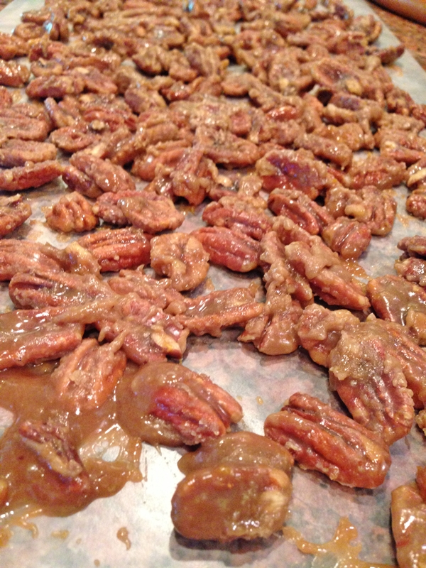 Wax paper covered in Homemade Candied Pecans www.diningwithmimi.com