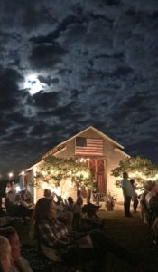 Moon at night at Weeks Bay Plantation barn with American Flag www.diningwithmimi.com