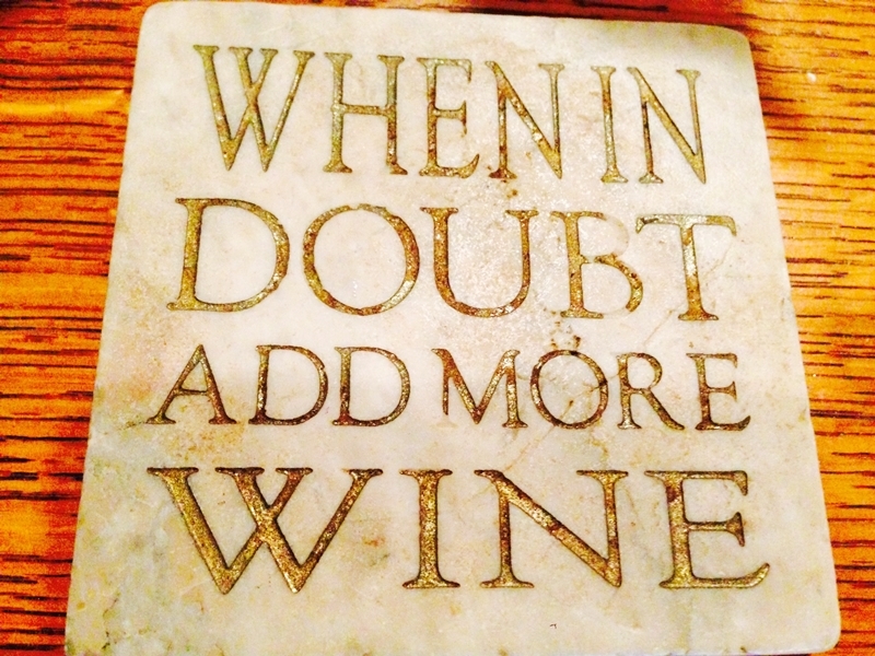 Sign on stone "When in Doubt Add More Wine" www.diningwithmimi.com