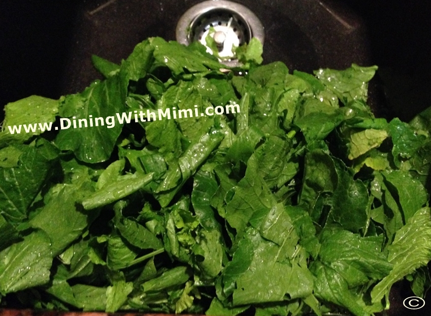 Sink filled of fresh washed Turnip Greens Jiffy Corn Muffin Mix Recipe for Jacked-Up Cornbread www.diningwithmimi.com