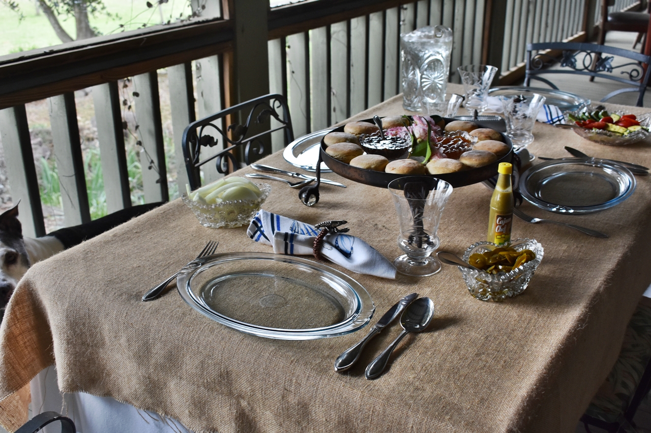 Porch table setting for Drowning Seasoned Pork Roast in Yesterday's Wine www.diningwithmimi.com