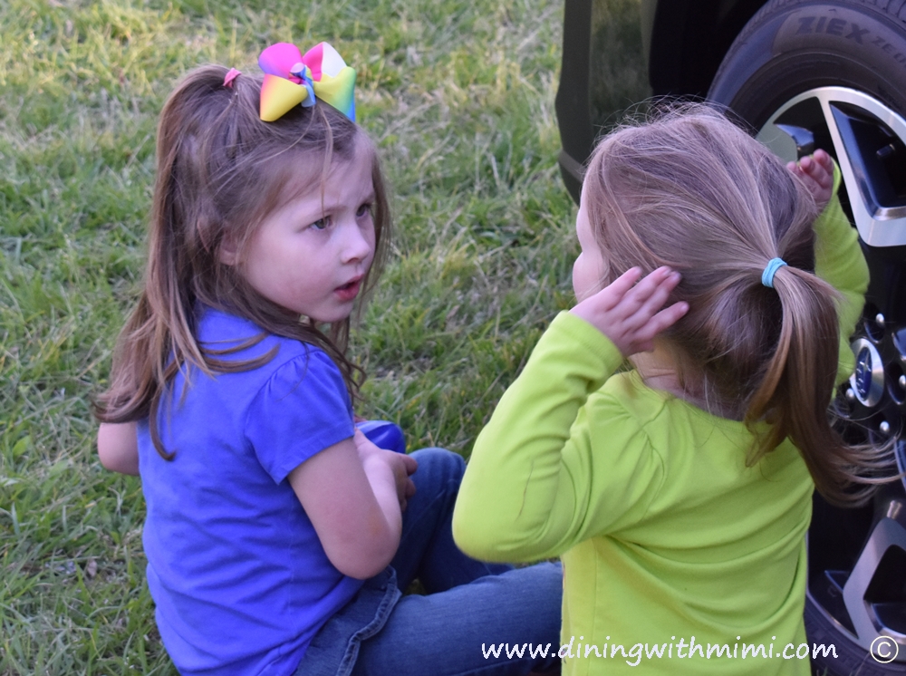 Cute little girls engorssed in conversation about Soulful Sounds From Fairhope Alabama With Jimmy Lumpkin And The Revivals www.diningwithmimi.com