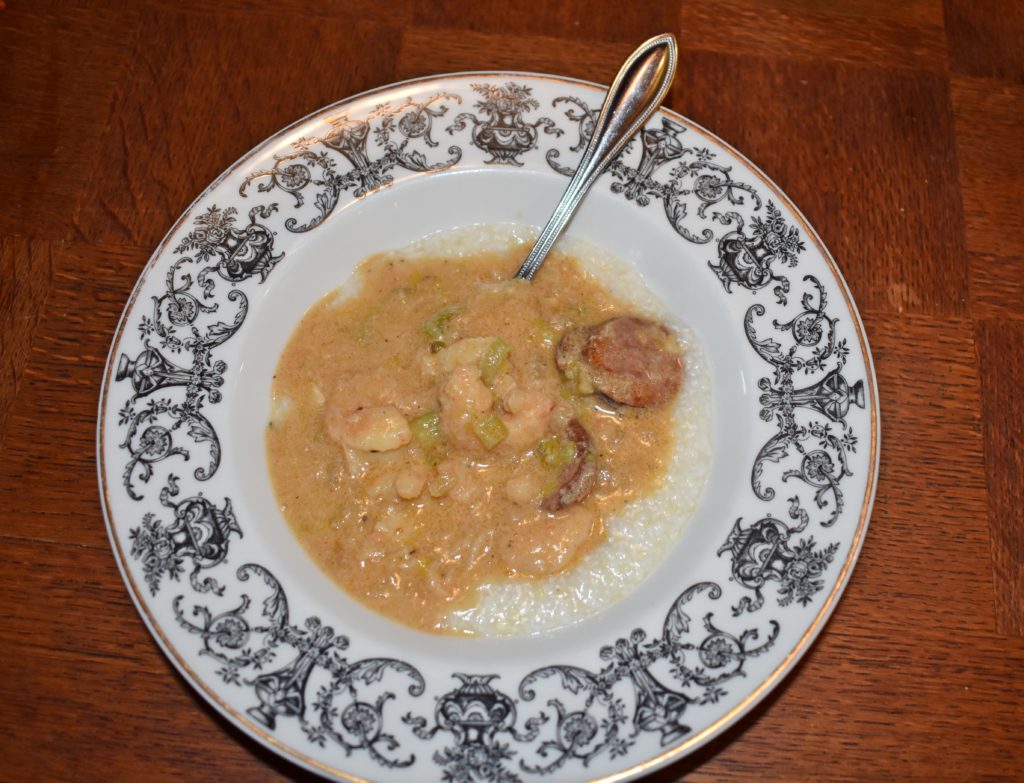 Bowl of heaven called Spicy Gulf Shrimp Gravy, Andouille Sausage and Grits Recipe www.diningwithmimi.com