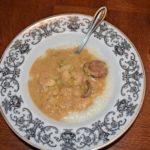 Bowl of heaven called Spicy Gulf Shrimp Gravy, Andouille Sausage and Grits Recipe www.diningwithmimi.com