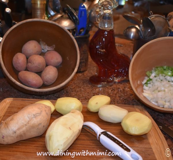 Potatoes on cutting board for Save a Ham Bone, Feed a Cowboy Soup Recipe www.diningwithmimi.com