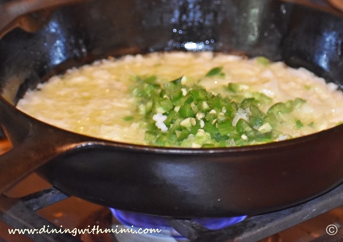 Iron skillet filled with butter, onions and jalapenos for Mimi's Kickin Corn and Rice Casserole www.diningwithmimi.com