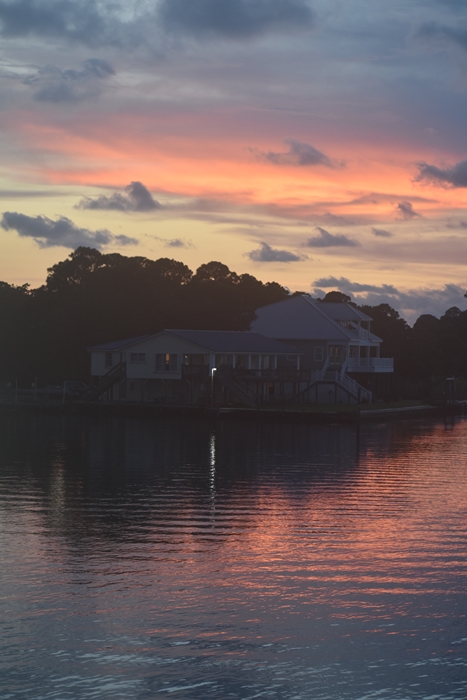 Pink and Blue sky reflected on Bay over House for Unwind on Dauphin Island www.diningwithmimi.com