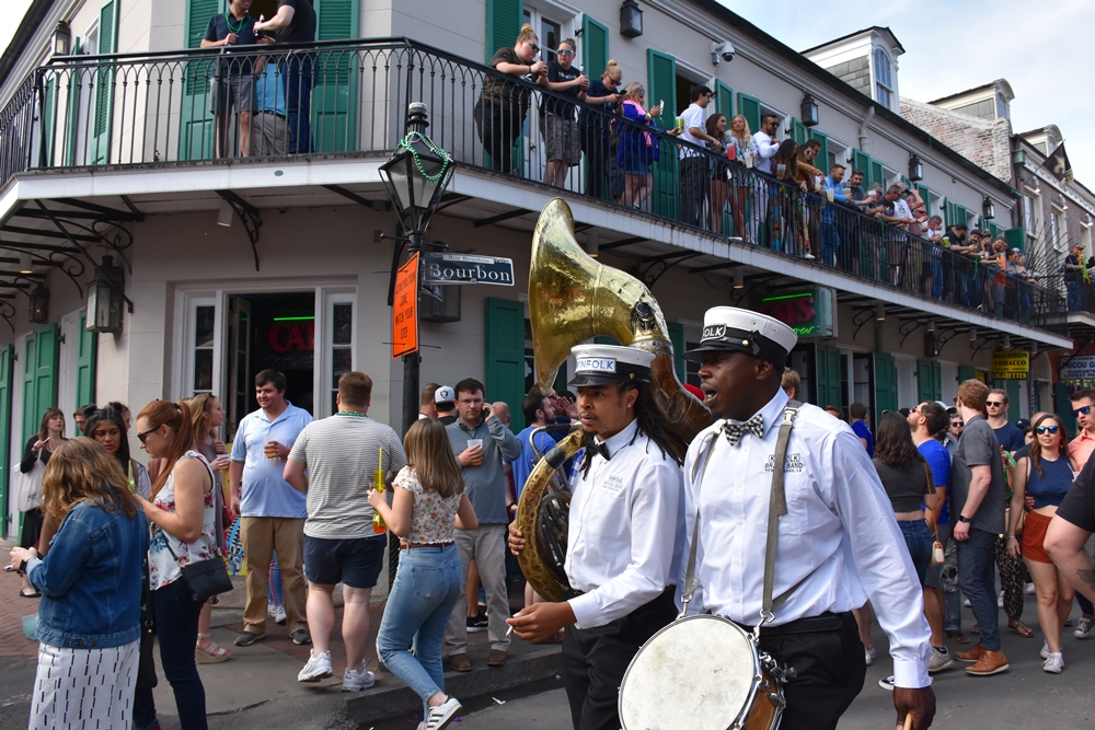 Bourbon St street scene people and Brass Band Need a quickie- Drop into New Orleans for 48 hours www.diningwithmimi.com