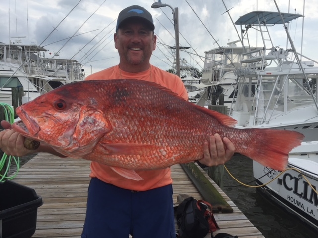 Dish Man with his Catch of the day for Fish to Table- Sriracha Kissed Fresh Snapper and More www.diningwithmimi.com