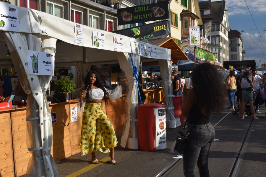 Food booths line the river in Zurich in Missing The Swiss while Jet-lagged and hoarding chocolate www.diningwithmimi.com