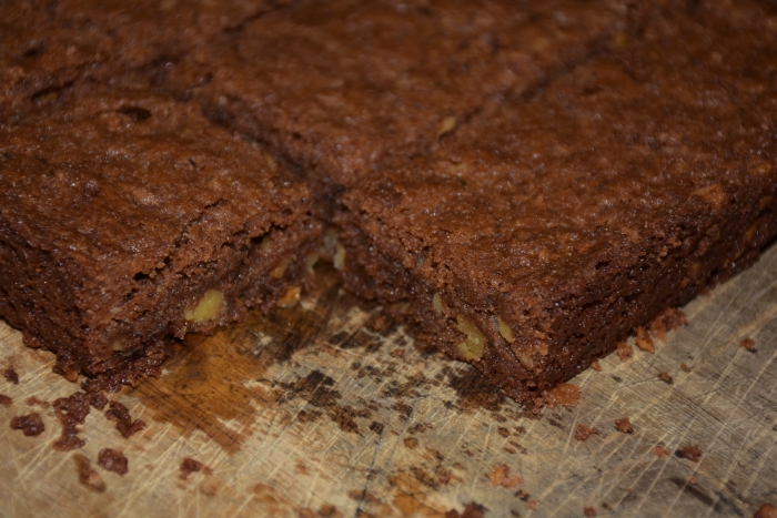 Nutty Fudgy Indulgent Brownies on cutting board www.diningwithmimi.com