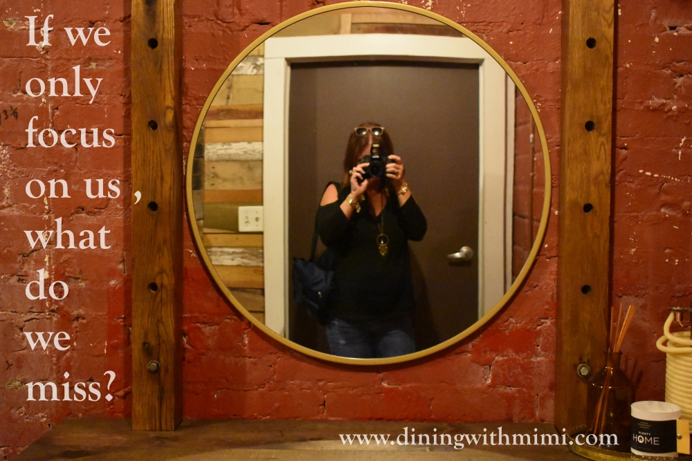 Photo of brick wall with reflection in mirror of photographer for April 2020 Hoda wan Kenobi www.diningwithmimi.com